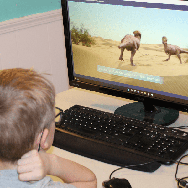 student learning about dinosaurs with Allschool