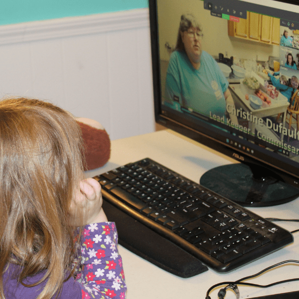 girl learning about animals with a zookeeper during an Allschool class