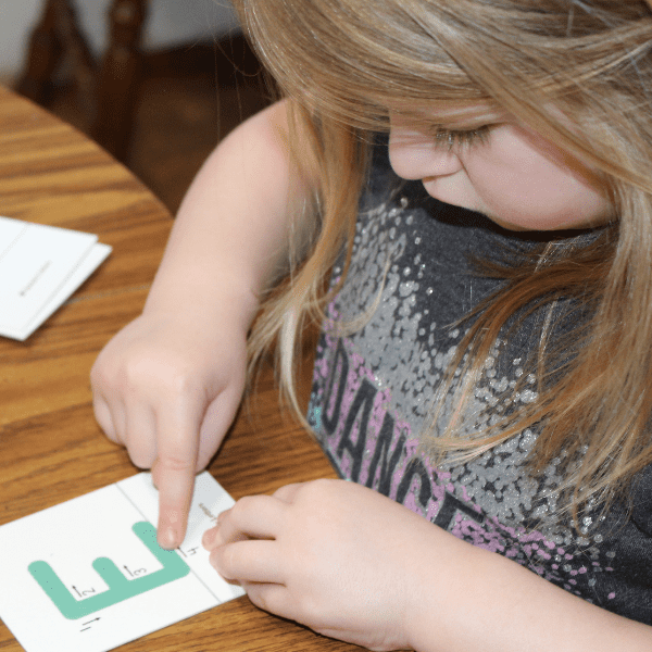 child doing Montessori Preschool for Homeschool with Sonlight