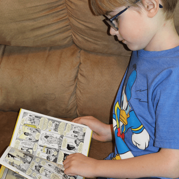 child reading book to study history