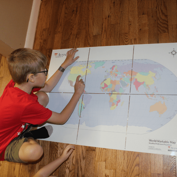 1st grade students studying a map as a part of their BookShark Homeschool History Curriculum for 1st Grade