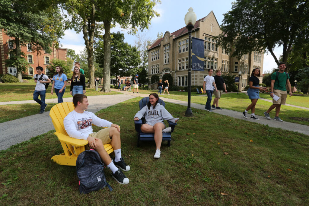homeschool students sitting in chairs at Thiel College