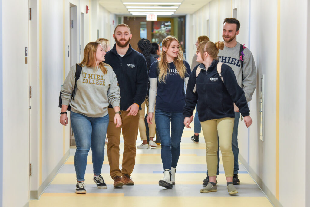 students walking down the hallway at Thiel College- the perfect solution for your homeschool college search