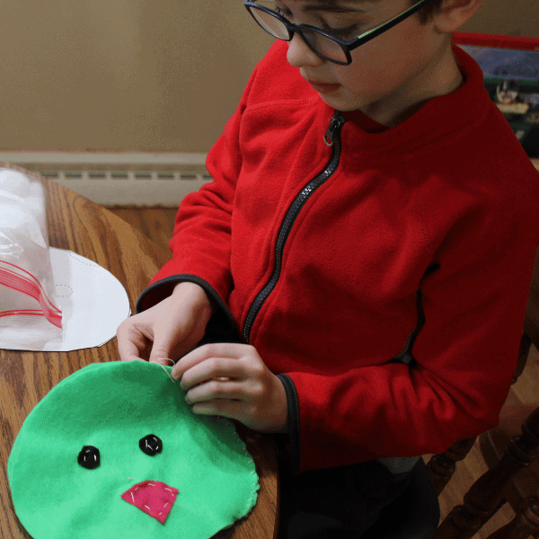 student learning to sew with his homeschool life skills curriculum