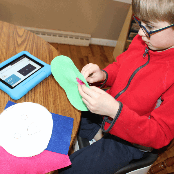 child sewing with The Makers Club from Elevation Handmade