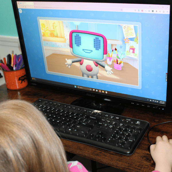 child practicing reading with online homeschool in kindergarten