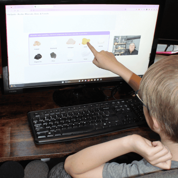 student learning about rocks and minerals with his middle school science curriculum in homeschool