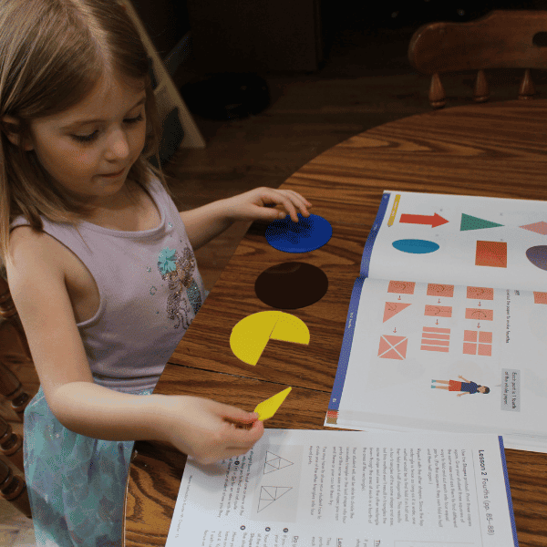 girl learning about fractions with Dimensions Math