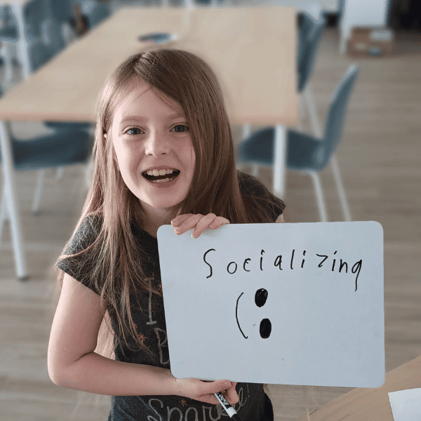 homeschooler wrote socializing on a white board