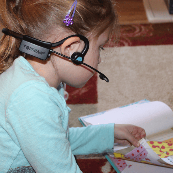girl using Forbrain headset for homeschool