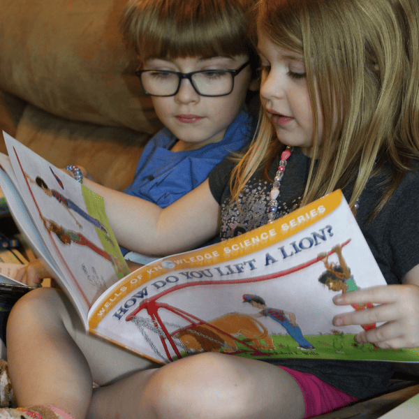 Kids reading together from their Sonlight history curriculum after we made the switch